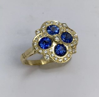  18 K sapphire and diamond ring made by: Nobel Antique jewelry Store, Santa Monica. Made in America.